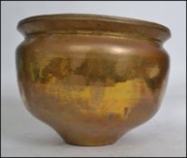 A very large 20th century heavy unusual hand beaten Arts and Crafts style copper / brass vase