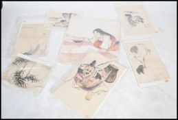 A collection of Chinese watercolour / pen and ink paintings,all unframed having scenes of crane