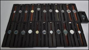 A collection of thirty four contemporary gentleman's wrist watches and time pieces all held within