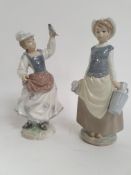 A good pair of Lladro figurines to include girl with dove raised on naturalistic plinth together