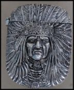 A silver plated vesta case being cast in relief in the form of a native Indian having hinged top