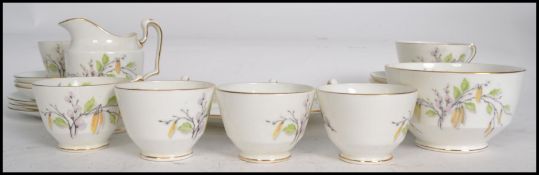 A vintage 20th century Staffordshire 6 person bone china tea service having a catkins flower