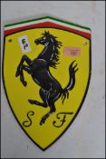 A vintage style cast iron advertising point of sale motoring plaque sign of Ferrari having the