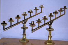 A fantastic pair of 20th century polished brass Menorahs / of angular form raised on hexagonal