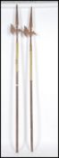 A pair of decorative 20th century large Poleaxes, each on hexagonal wooden poles with cast metal axe