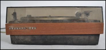 A Bang & Ouelfsun Beogram 1000 vinyl record turntable, on a sprung, teak finished base having a