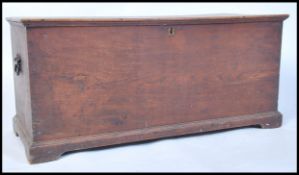 A Victorian 19th century elm wood blanket box chest raised on plinth base with hinged top having