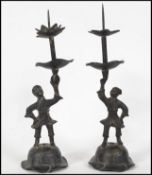 A pair of 19th century Oriental bronze candlestick