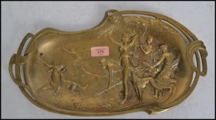 A vintage early 20th century Art Nouvaeu French brass tray depicting women hunting being cast in
