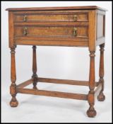 A 1920's oak barley twist canteen cutlery table / side table being raised on barleytwist supports
