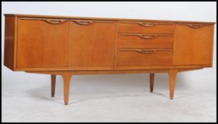 A vintage retro 20th century 6' teak wood sideboard having a series of drawers and cupboards