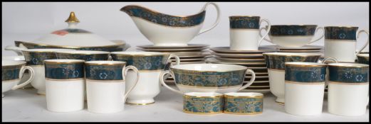 A Royal Doulton ceramic dinner and tea service in the Carlyle pattern. To include cups, saucers,