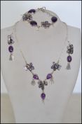 A silver 925 designer matching necklace, bracelet and earring set set with black baroque pearls