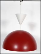 A retro style space age ceiling light fixture having a large bulbous half moon red enamel pendant