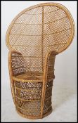 A vintage 20th century / late 1970's retro wicker peacock armchair -chair. Large open back chair