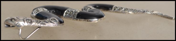 A contemporary silver and onyx necklace pendant in the form of  a large snake. Total weight 14g /