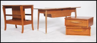 A collection of retro furniture to include a teak wood magazine rack table, a pair of teak single