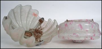 A 1930's Art Deco clam shell Odeon style ceiling light having white frosted glass clam shell