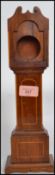 A Victorian mahogany pocket watch stand in the form of a long-case / grandfather clock. The mahogany