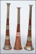 A set of 2 Kohler & Son copper and silver hallmarked banded hunting horns. The silver to one