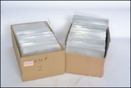 Postcard sleeves in two boxes - shoebox size. Clean no stickers and 