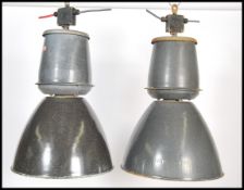 A pair of large vintage industrial 20th century factory black enamel ceiling lights. Each  retaining