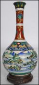 A Chinese 19th century handpainted vase of baluster form with a tall waisted neck with handpainted