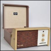 A vintage mid 20th century Dansette Challenge 106 vinyl record player having a 4 speed Monarch