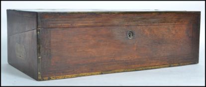 A 19th century Victorian mahogany and brass bound writing slope, the slope having a fully
