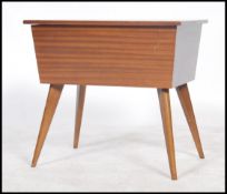 A retro 20th century work box and contents, hinged lid opening to reveal a sliding removable tray