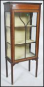 An Edwardian mahogany inlaid display cabinet havin