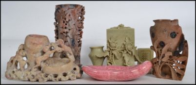 A decorative early 20th century soapstone spill vase holder with matchbox holder and spill holder