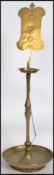 A vintage 19th century Oriental temple large pricker brass candlestick having a lozenge back panel