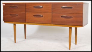 A vintage / retro 20th century teak wood Danish inspired sideboard having a series six drawers