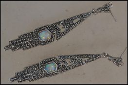 A pair of silver Art Deco style marcasite opal drop earrings complete in the presentation case.