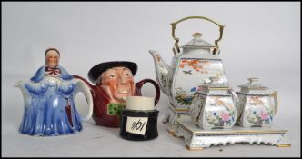 A collection of teapots to include examples such as  Franklin Mint Ltd edition teapot with creamer