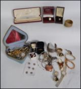 A collection of vintage 20th century costume jewellery to include bracelets, broaches, necklaces,