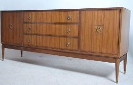 A good 1960's Danish Influence teak wood sideboard being raised on turned legs with a central bank