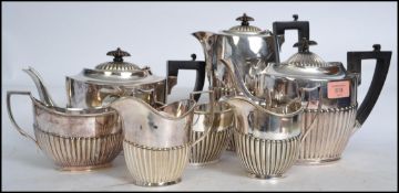 An early 20th century silver plate 4 piece tea and coffee service by Levesley Brothers comprising