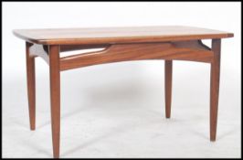 A vintage retro teak coffee table by E Gomme 1950's,  the rectangular top with rounded ends on