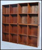 A set of 4 1970's teak quarter section Danish style modular bookcase units. Each section with qtr