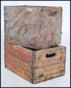 A pair of vintage mid century wooden advertising beer bottle crates, each with notation for Watney