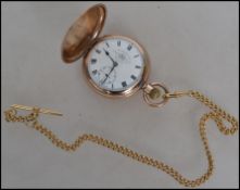 An early 20th Century gentleman's gold tone metal, full hunter cased pocket watch by Thomas Russel &