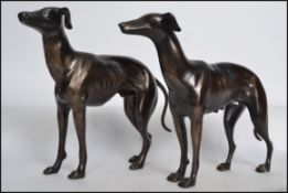 A pair of vintage style cast iron grey hound figurines having a bronze effect finish. Measures: 30cm
