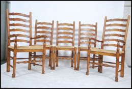 A set of 5 Brights of Nettlebed antique style rattan weave ladderback dining chairs. Each raised