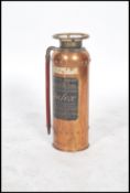 An early 20th century copper fire extinguisher by Safex having appointed house with further notation