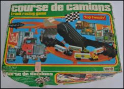 An unusual vintage 20th century French Course De Camions truck racing game - slot car. In the