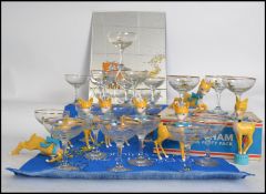 A collection of vintage and retro Babycham advertising pieces to include several glasses, one set