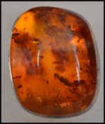 A hallmarked 925 Danish silver and amber dress ring. Import marks for London. Size R.5.