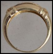 A hallmarked 9ct gold and diamond  band ring with